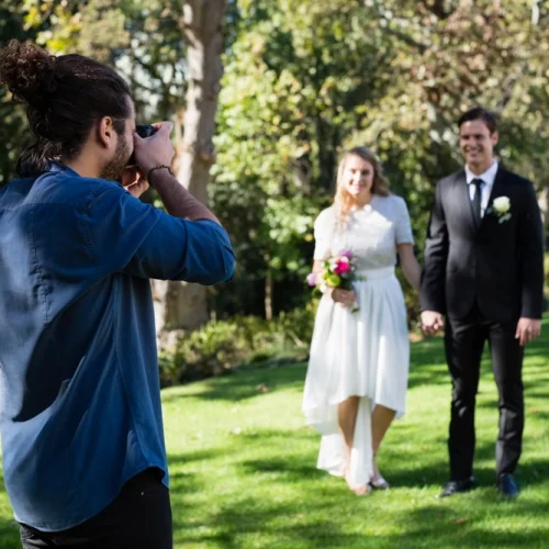 photographer-taking-photo-of-newly-married-couple-2023-11-27-05-09-45-utc